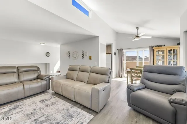 a living room with fireplace furniture and a flat screen tv