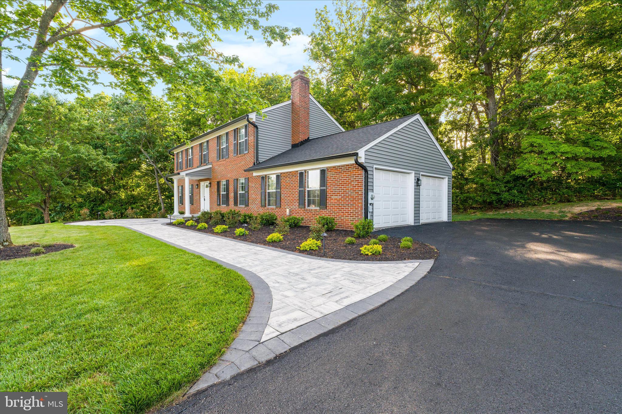 3908 Shakespeare Way Monrovia, MD 21770 - Photo 5 of 59 a front view of a house with a garden and yard