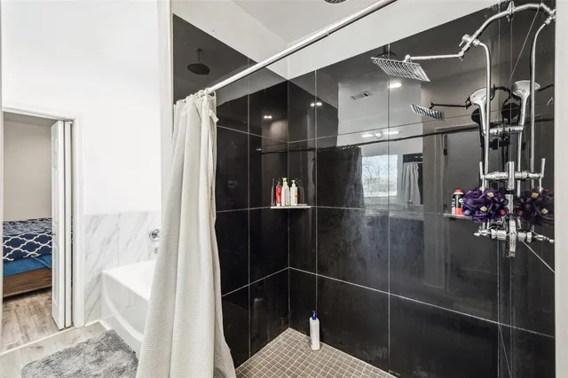 a bathroom with a glass shower door