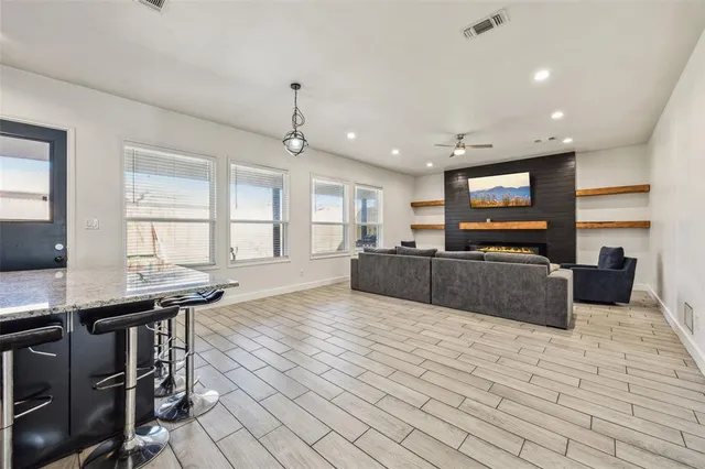 a large kitchen with lots of counter space and windows