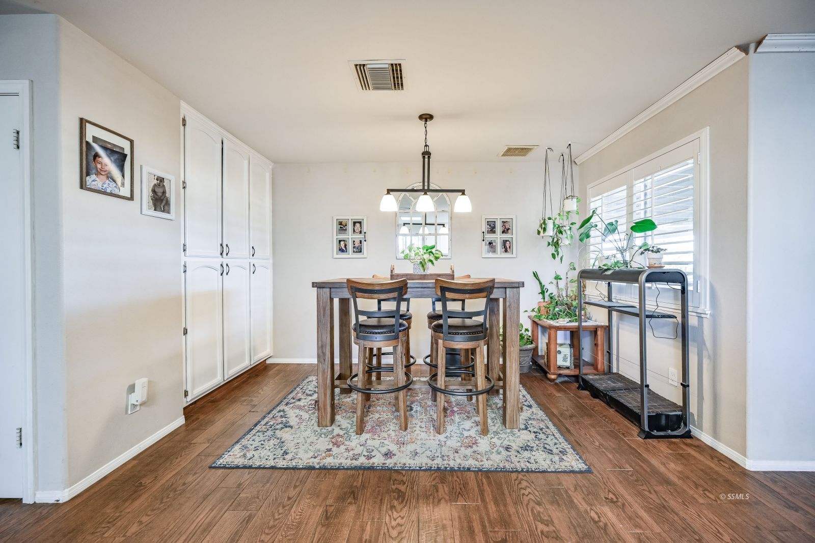 424 Marlene Court Ridgecrest, CA 93555 - Photo 6 of 38 a dining room with furniture a rug and a chandelier