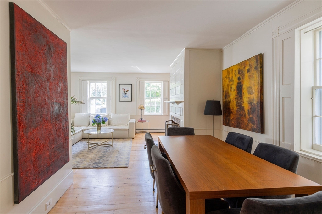 7 Waldron Court Marblehead, MA 01945 - Photo 6 of 26 a large bedroom with a large bed and wooden floor