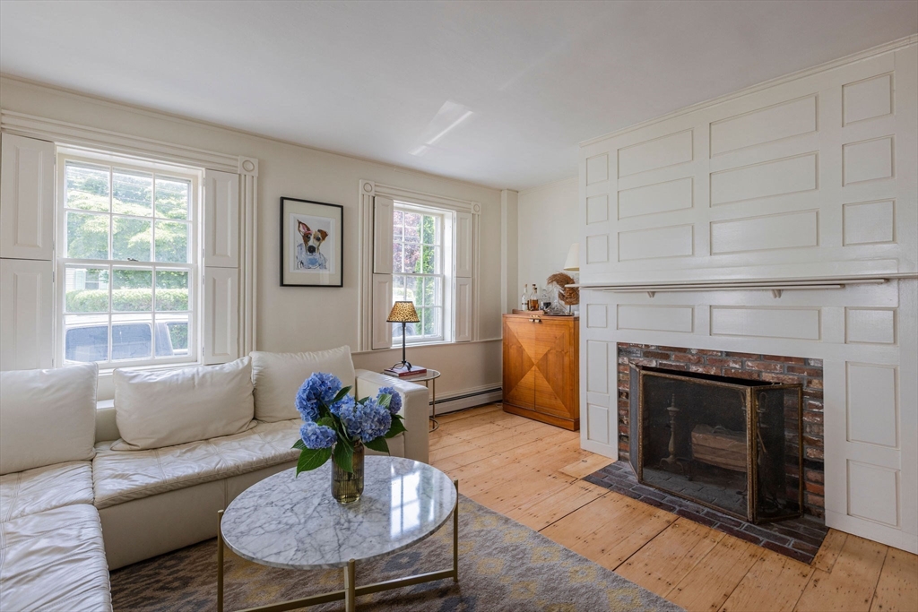 7 Waldron Court Marblehead, MA 01945 - Photo 8 of 26 a living room with furniture and a fireplace
