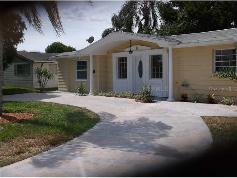4345 Craftsbury Drive New Port Richey, FL 34652 - Photo 1 of 1 a front view of a house with a yard