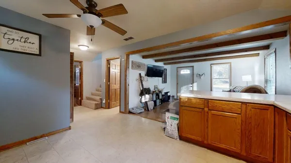 a very nice looking room with a large window and couch