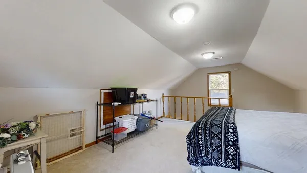 a bedroom with furniture and a window