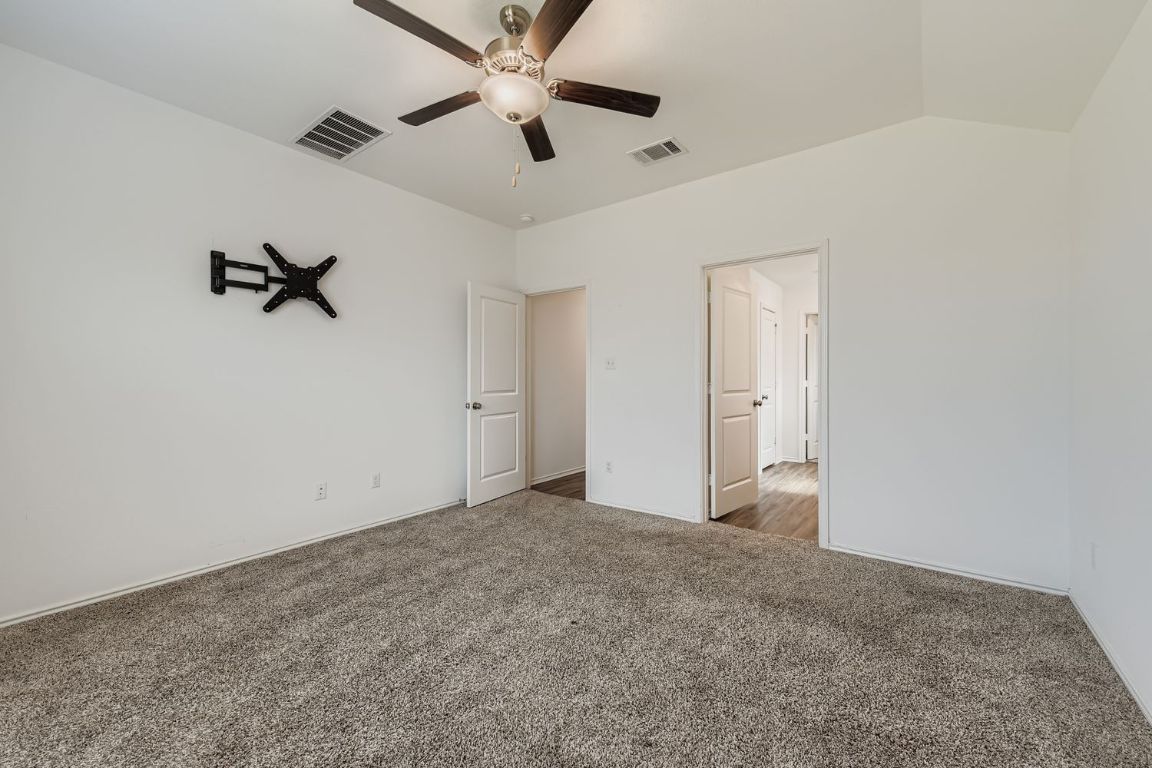 210 Montego Street Hutto, TX 78634 - Photo 15 of 29 wooden floor in an empty room