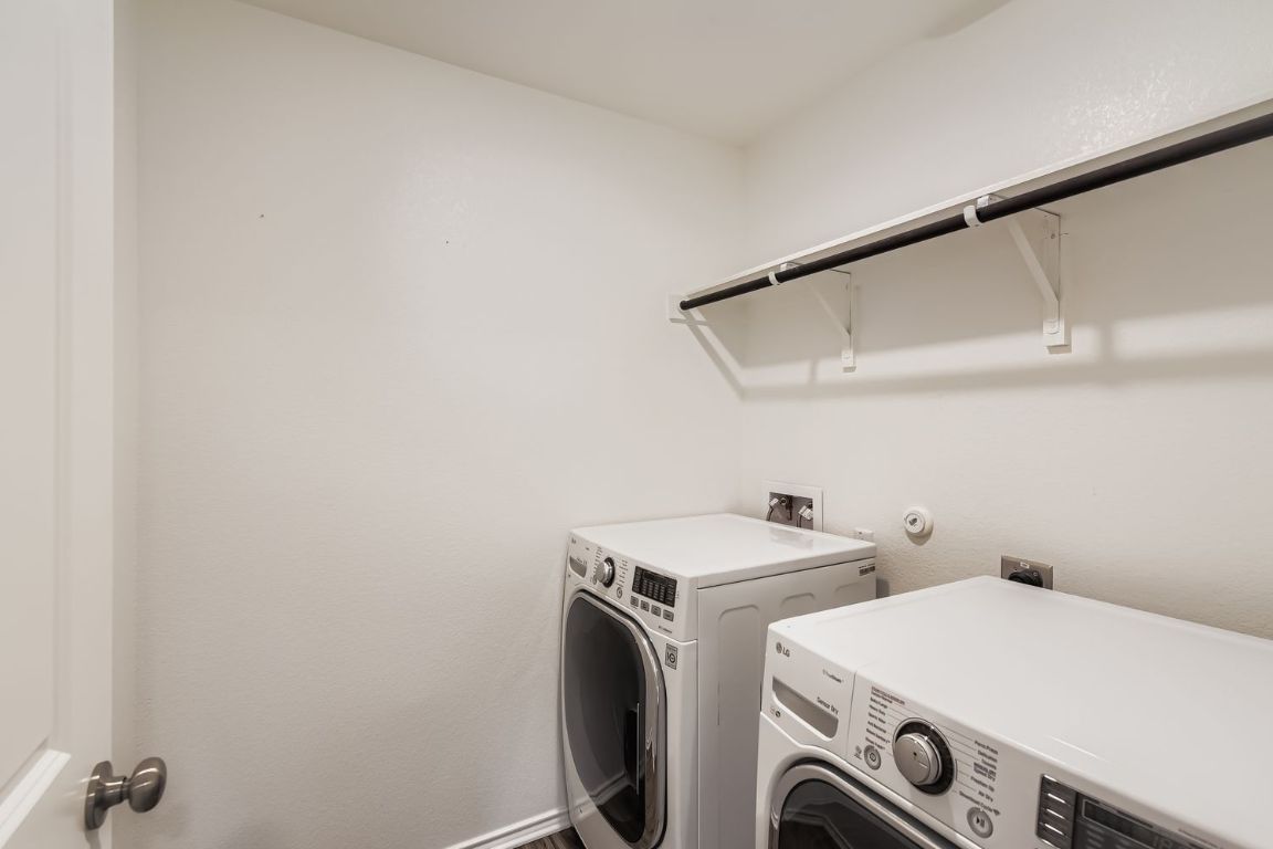 210 Montego Street Hutto, TX 78634 - Photo 23 of 29 a utility room with dryer and washer