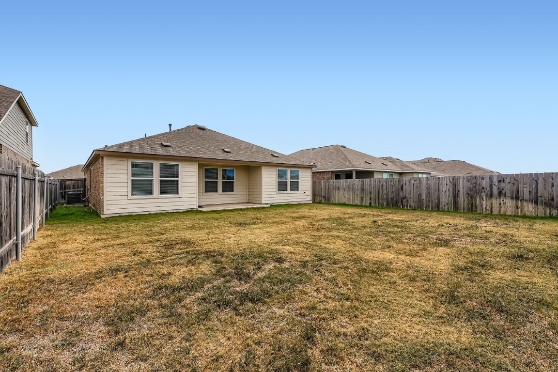 210 Montego Street Hutto, TX 78634 - Photo 28 of 29 a front view of a house with yard