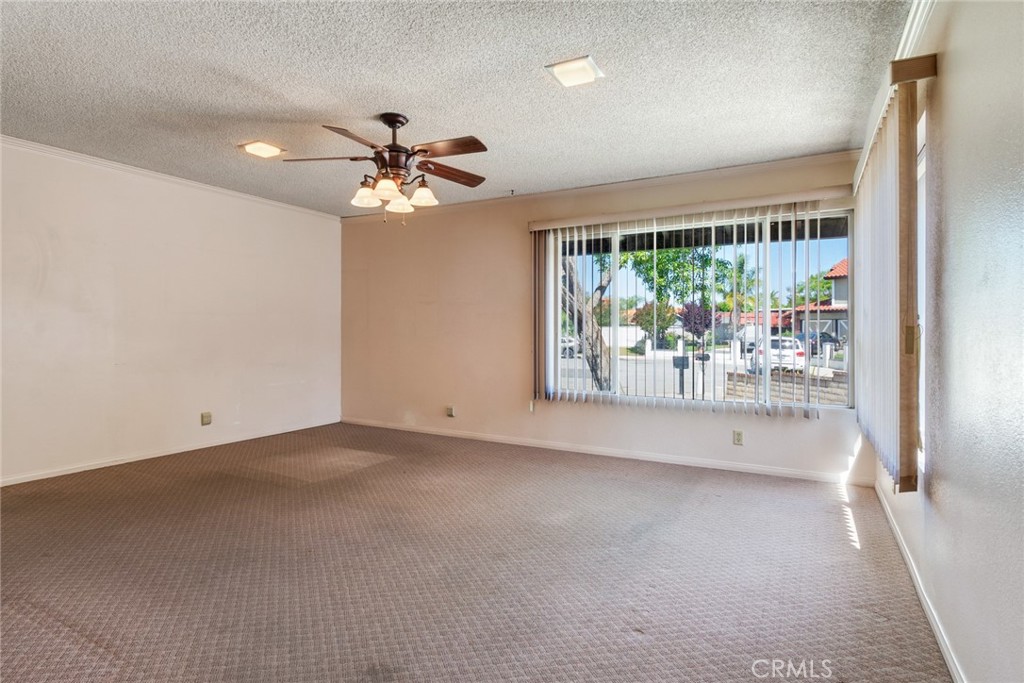 9130 Duncan Avenue Riverside, CA 92503 - Photo 13 of 34 an empty room with windows and outdoor view