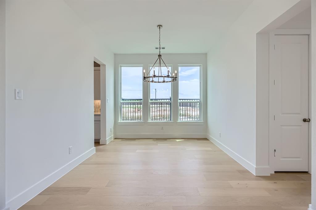 2620 Cedar Rdg Road Celina, TX 75009 - Photo 5 of 27 Unfurnished dining area featuring a chandelier and light wood-type flooring