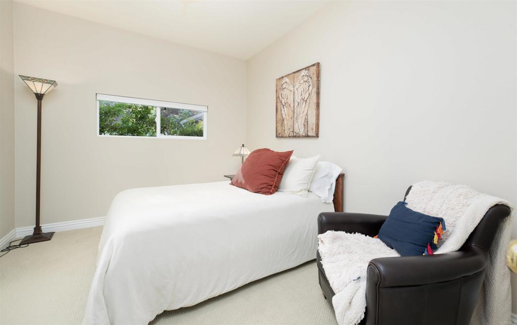 1677 Mission Meadow Drive Oceanside, CA 92057 - Photo 14 of 48 a bedroom with a bed and a couch