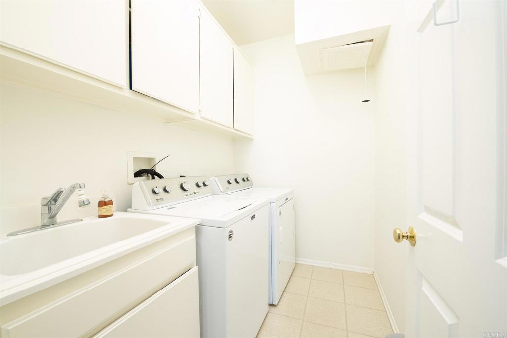 1677 Mission Meadow Drive Oceanside, CA 92057 - Photo 23 of 48 a utility room with dryer and washer