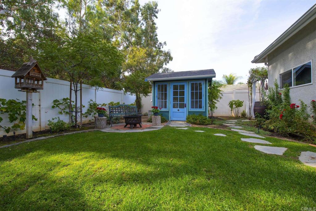 1677 Mission Meadow Drive Oceanside, CA 92057 - Photo 29 of 48 a house view with a sitting space and garden