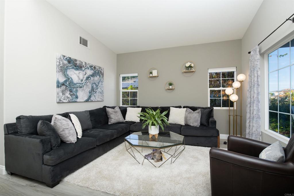 1677 Mission Meadow Drive Oceanside, CA 92057 - Photo 4 of 48 a living room with furniture and a large window