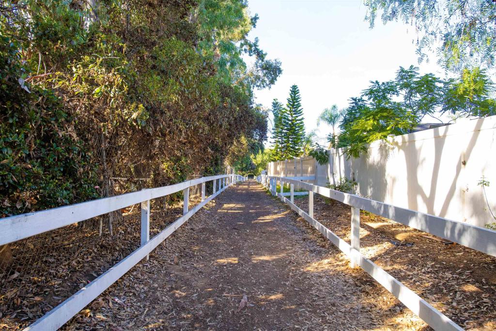 1677 Mission Meadow Drive Oceanside, CA 92057 - Photo 41 of 48 a view of a yard with wooden fence