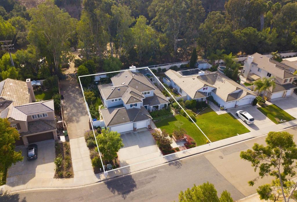 1677 Mission Meadow Drive Oceanside, CA 92057 - Photo 44 of 48 an aerial view of a house with a yard and lake view