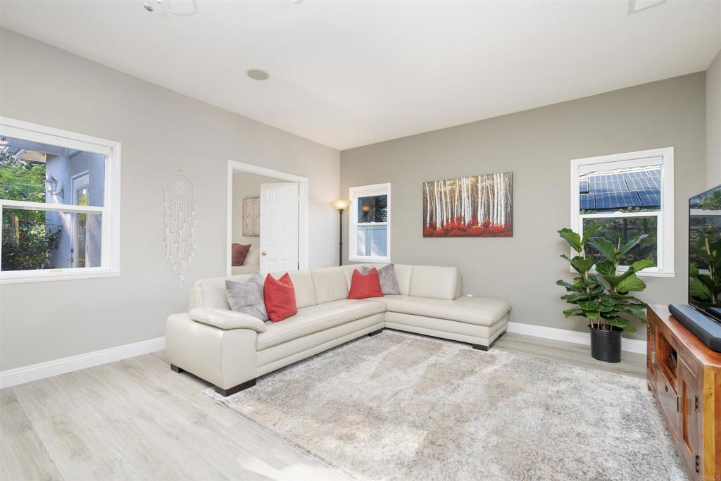 1677 Mission Meadow Drive Oceanside, CA 92057 - Photo 5 of 48 a living room with furniture and a potted plant