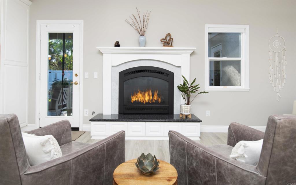 1677 Mission Meadow Drive Oceanside, CA 92057 - Photo 7 of 48 a living room with furniture and a fireplace
