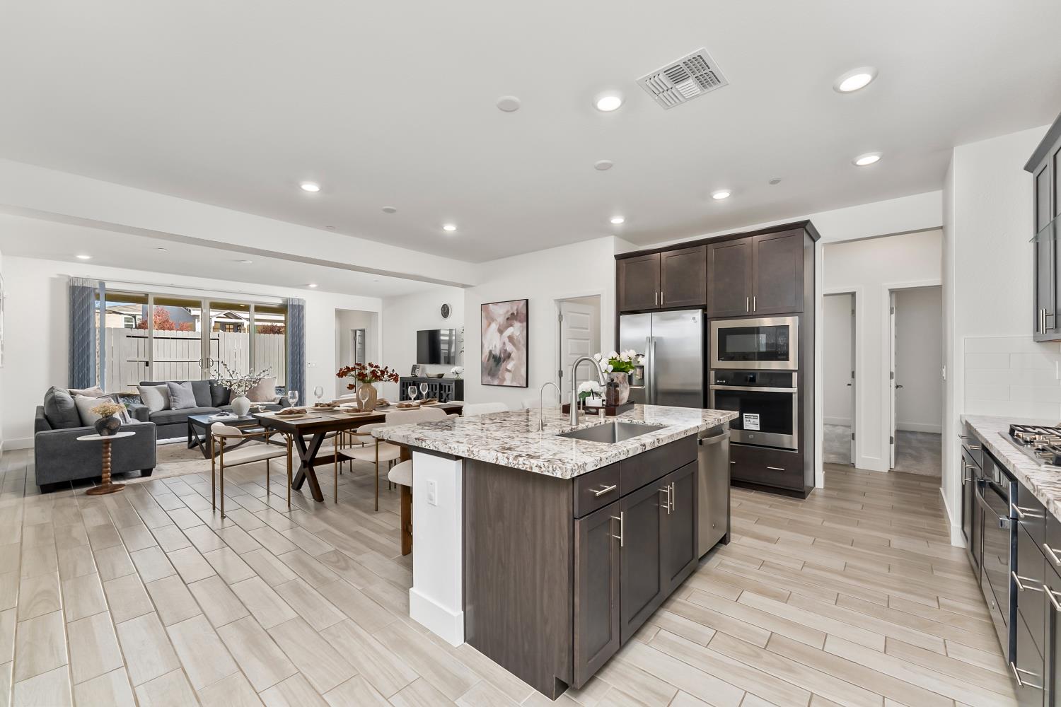 4156 Salt Point Way Rancho Cordova, CA 95742 - Photo 10 of 43 Open & airy great room concept in kitchen / family room