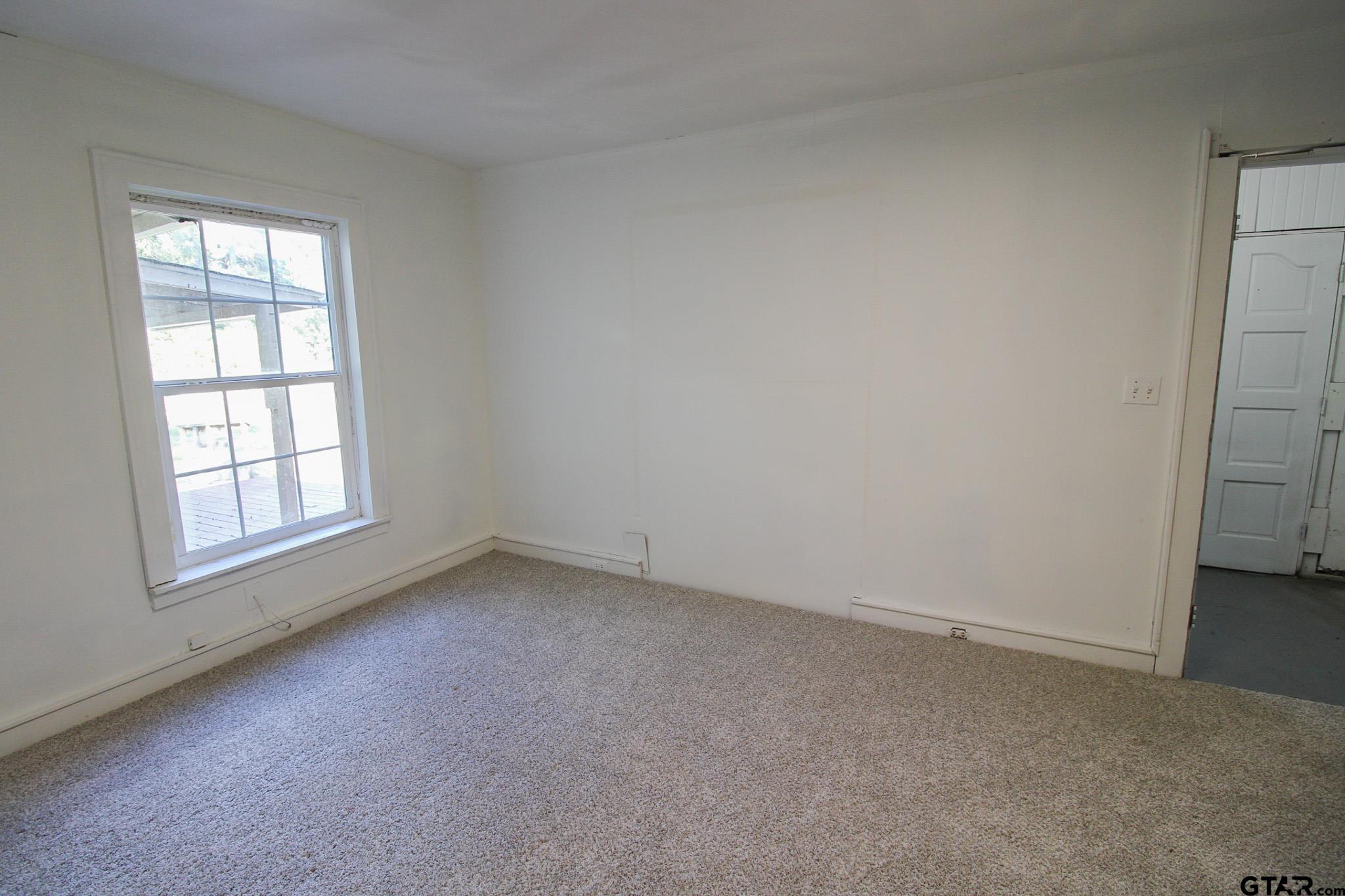 407 Pace Street Naples, TX 75568 - Photo 19 of 31 an empty room with a window