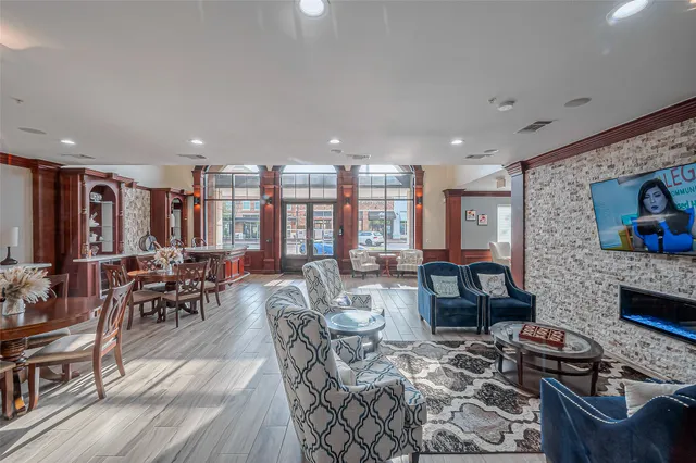 a living room with fireplace furniture and a flat screen tv