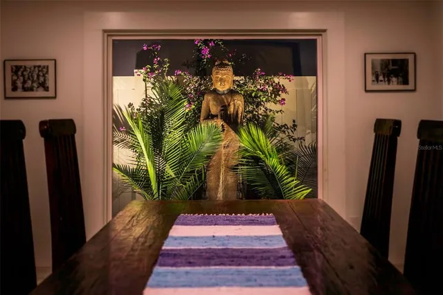 a view of kitchen with stainless steel appliances granite countertop sink and refrigerator