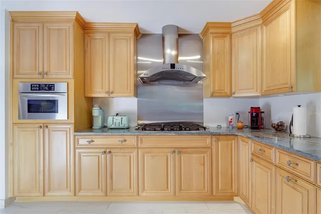 a view of a living room with furniture and a flat screen tv