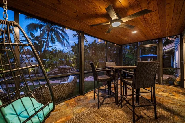 a view of a swimming pool with a patio and a yard