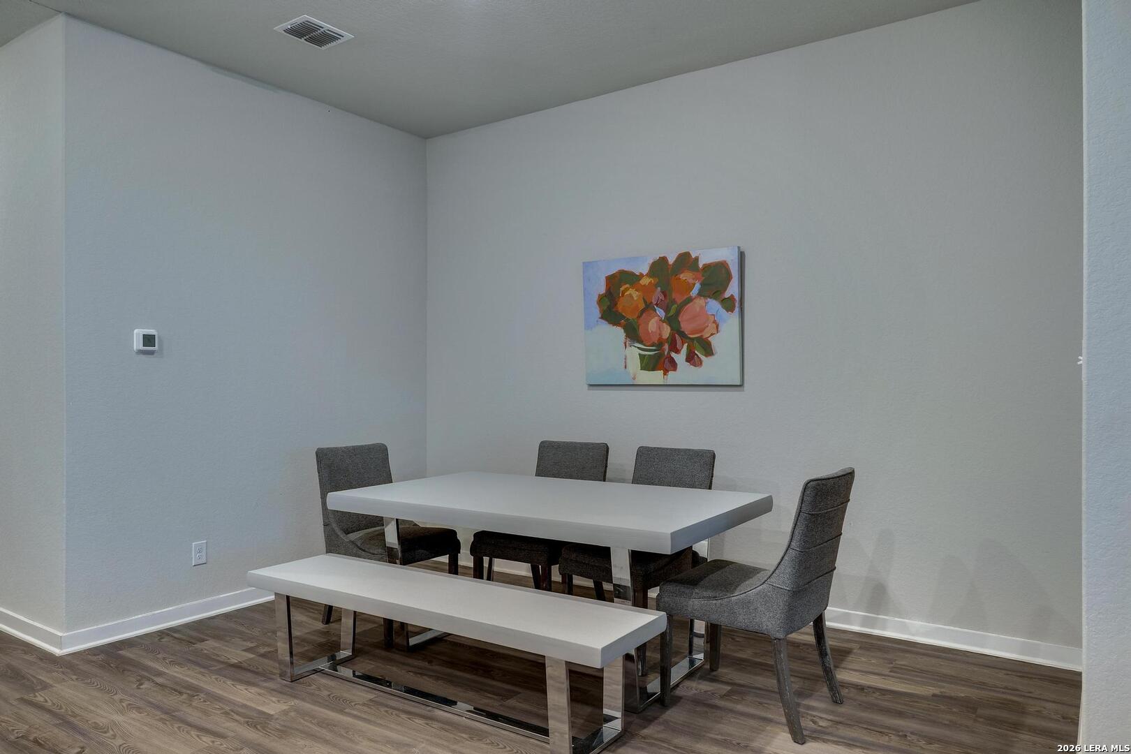6910 Shiraz Way Converse, TX 78109 - Photo 11 of 25 a view of a dining room with furniture and wooden floor