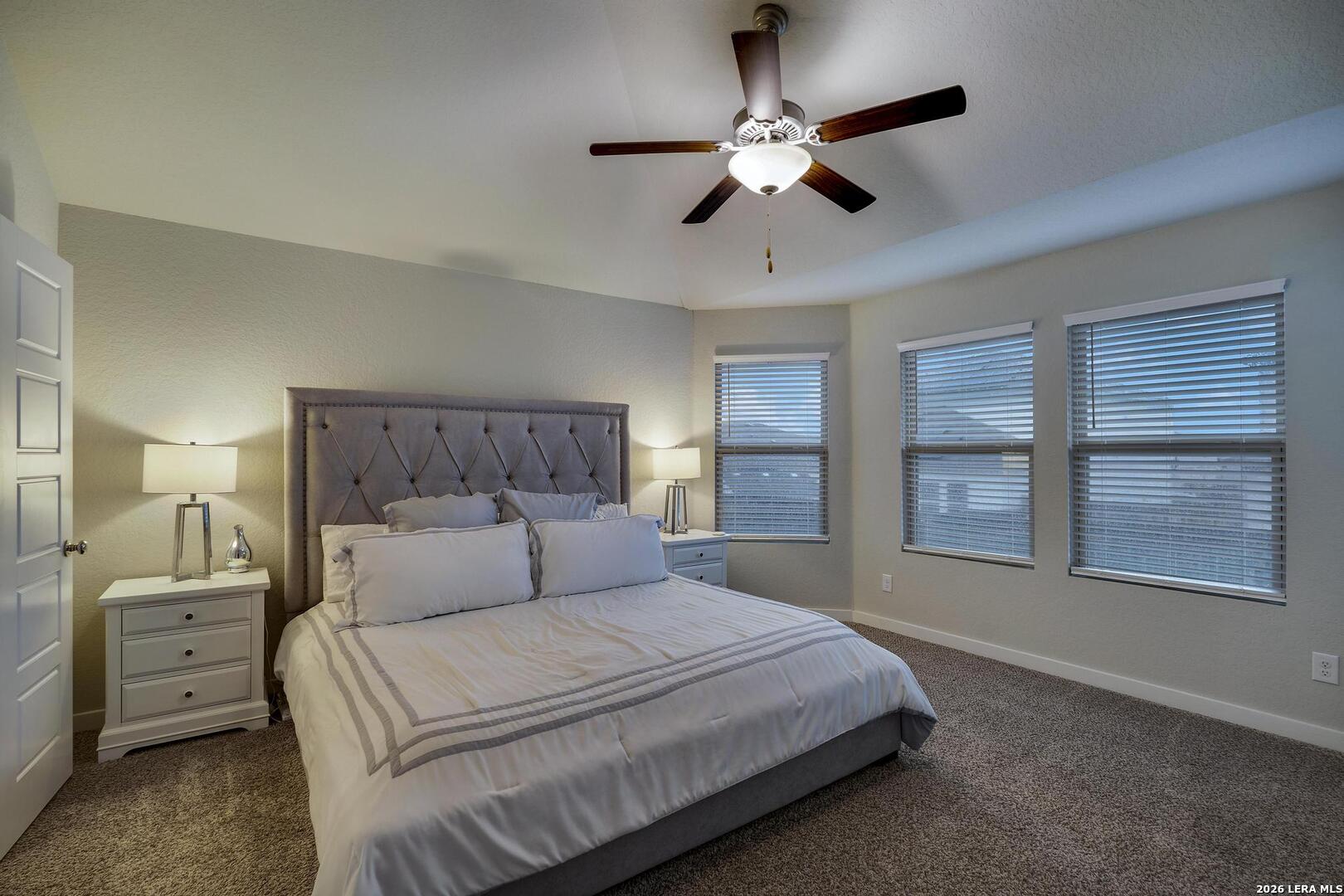 6910 Shiraz Way Converse, TX 78109 - Photo 12 of 25 a bedroom with a large bed and a tv