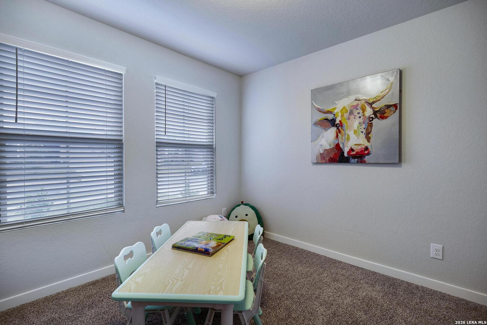 6910 Shiraz Way Converse, TX 78109 - Photo 17 of 25 a view of a dining room with furniture and a window