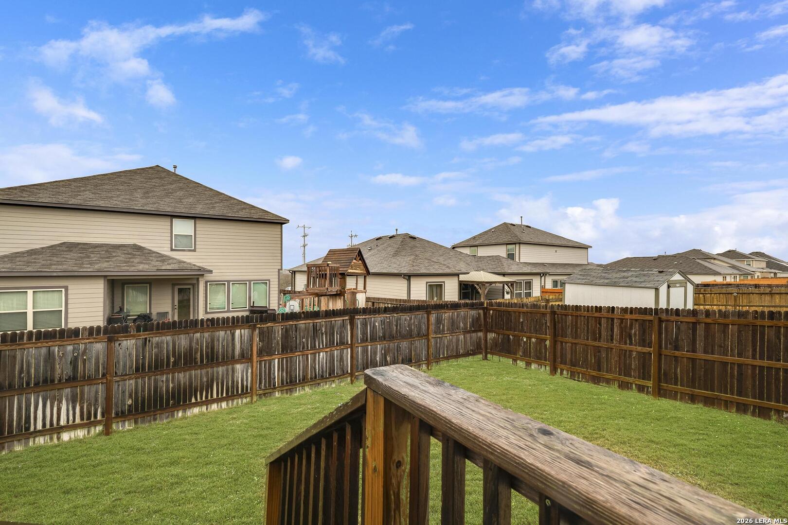 6910 Shiraz Way Converse, TX 78109 - Photo 24 of 25 a view of a yard with wooden fence
