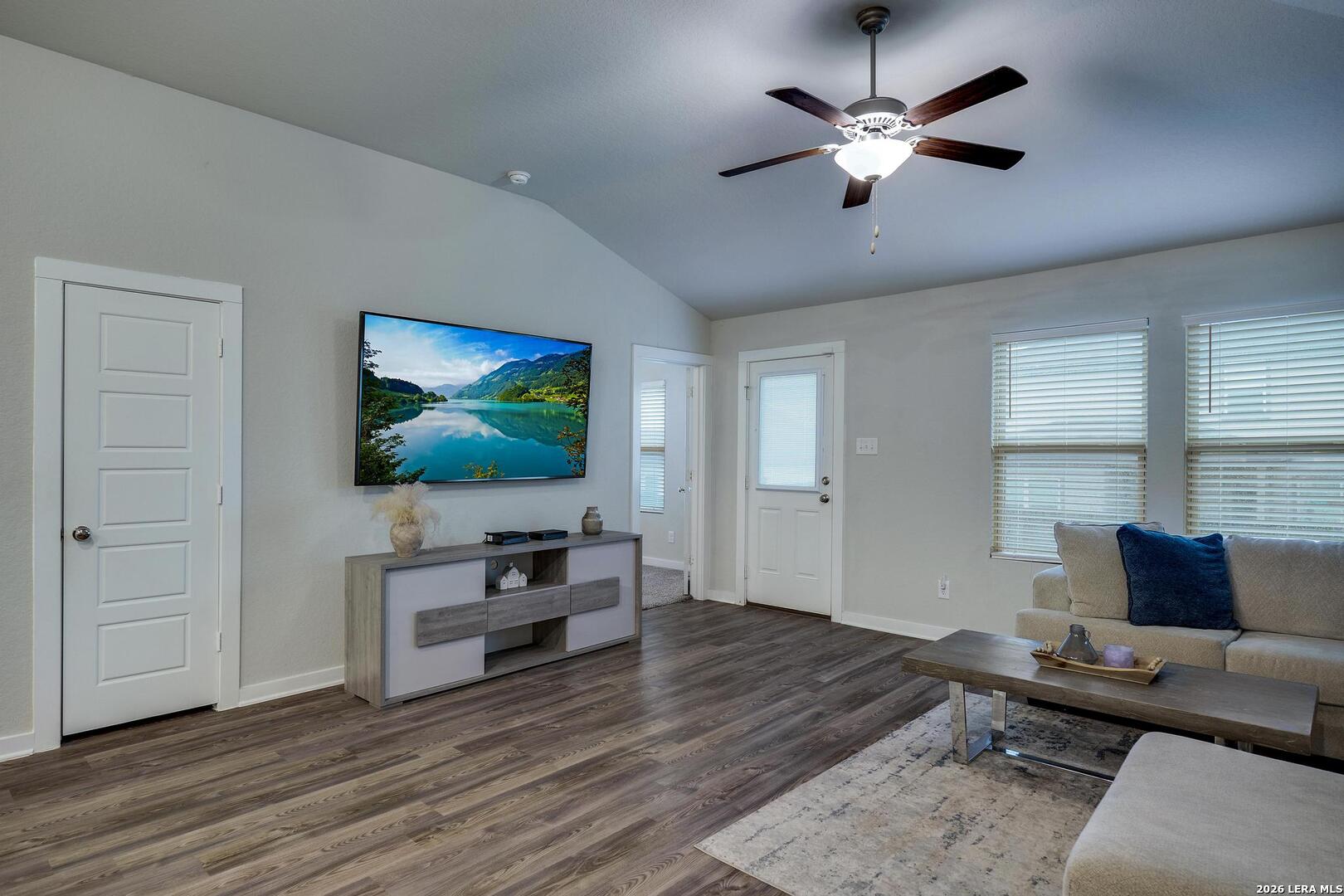 6910 Shiraz Way Converse, TX 78109 - Photo 3 of 25 a living room with furniture and a flat screen tv