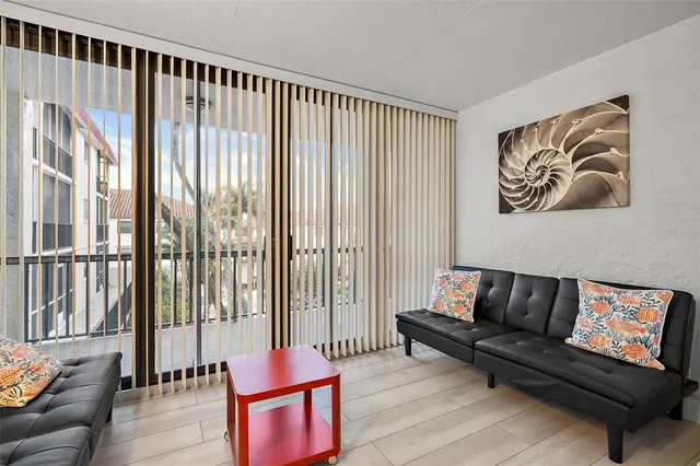 a living room with furniture and a large window