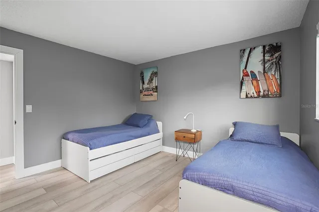 a living room with furniture and painting on the wall