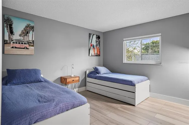 a bedroom with bed and window