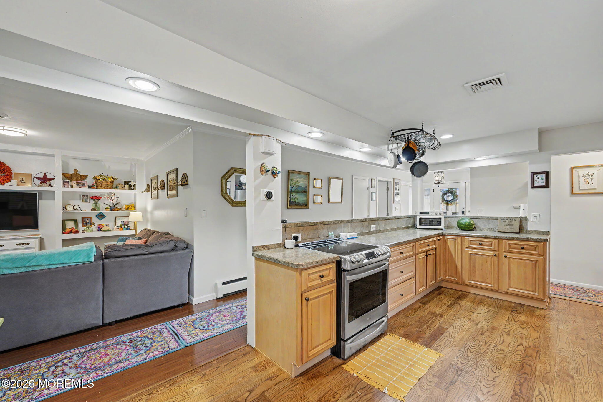 699 Aldrich Road Howell, NJ 07731 - Photo 6 of 30 a kitchen with stainless steel appliances granite countertop a stove and a sink