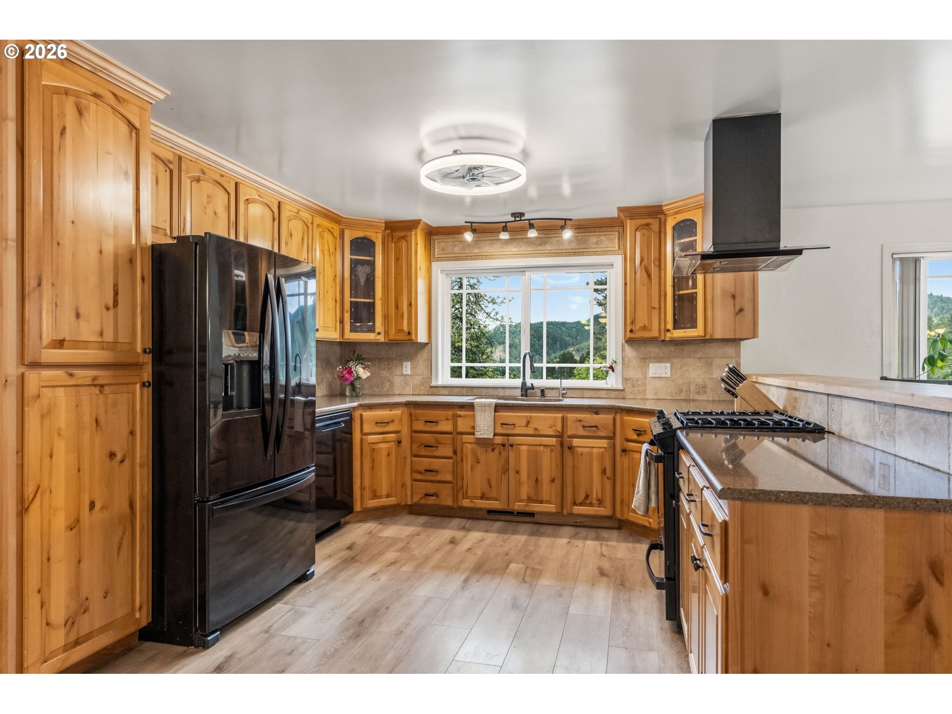 89093 Marcola Road Springfield, OR 97478 - Photo 13 of 25 a kitchen with stainless steel appliances granite countertop a refrigerator stove top oven and sink