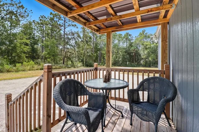 a view of a wooden chairs in balcony