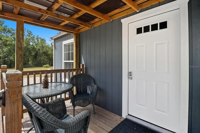 a view of a balcony with furniture