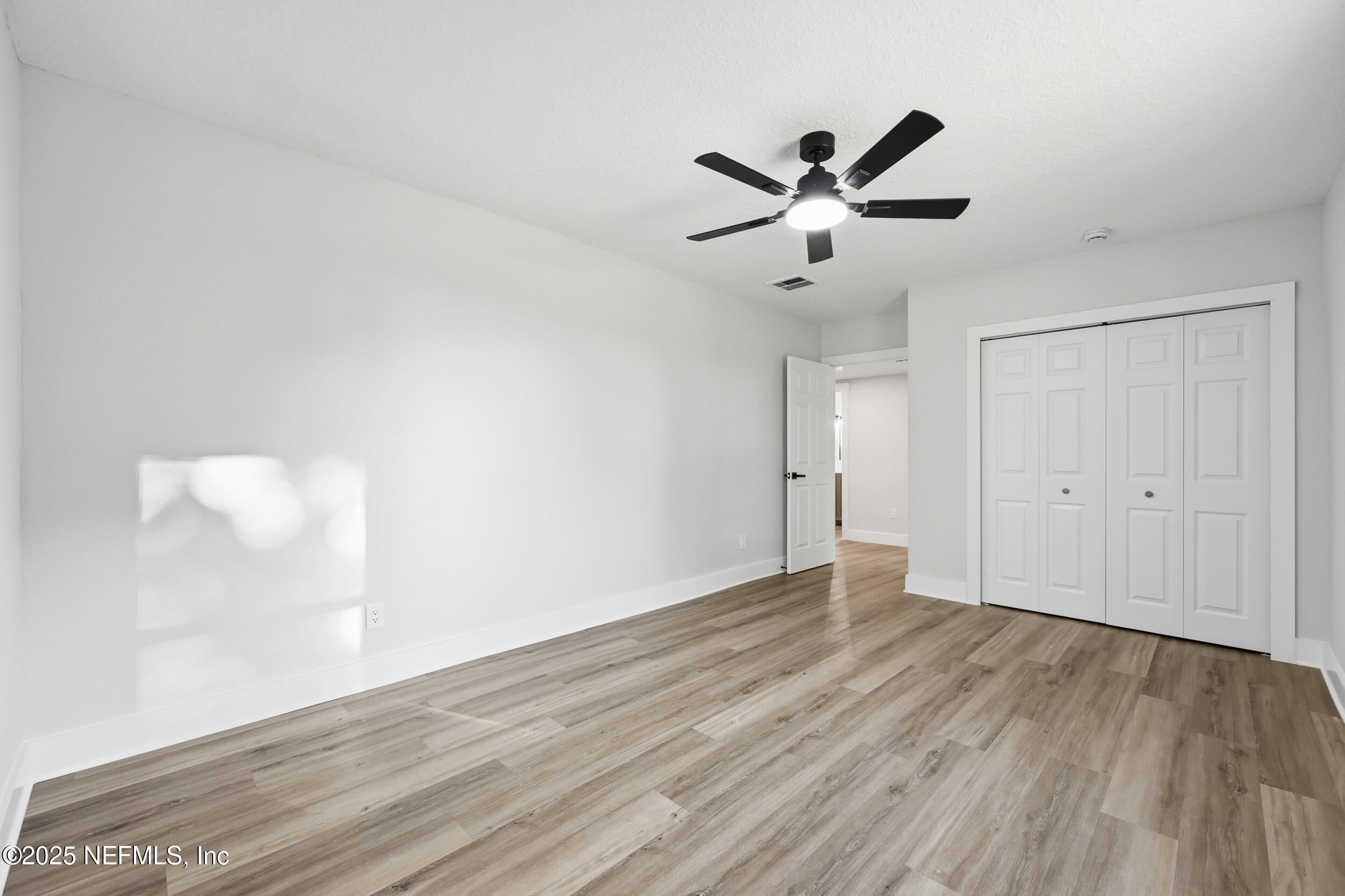 1440 Harbor Oaks Road Jacksonville, FL 32207 - Photo 28 of 63 a view of an empty room with wooden floor