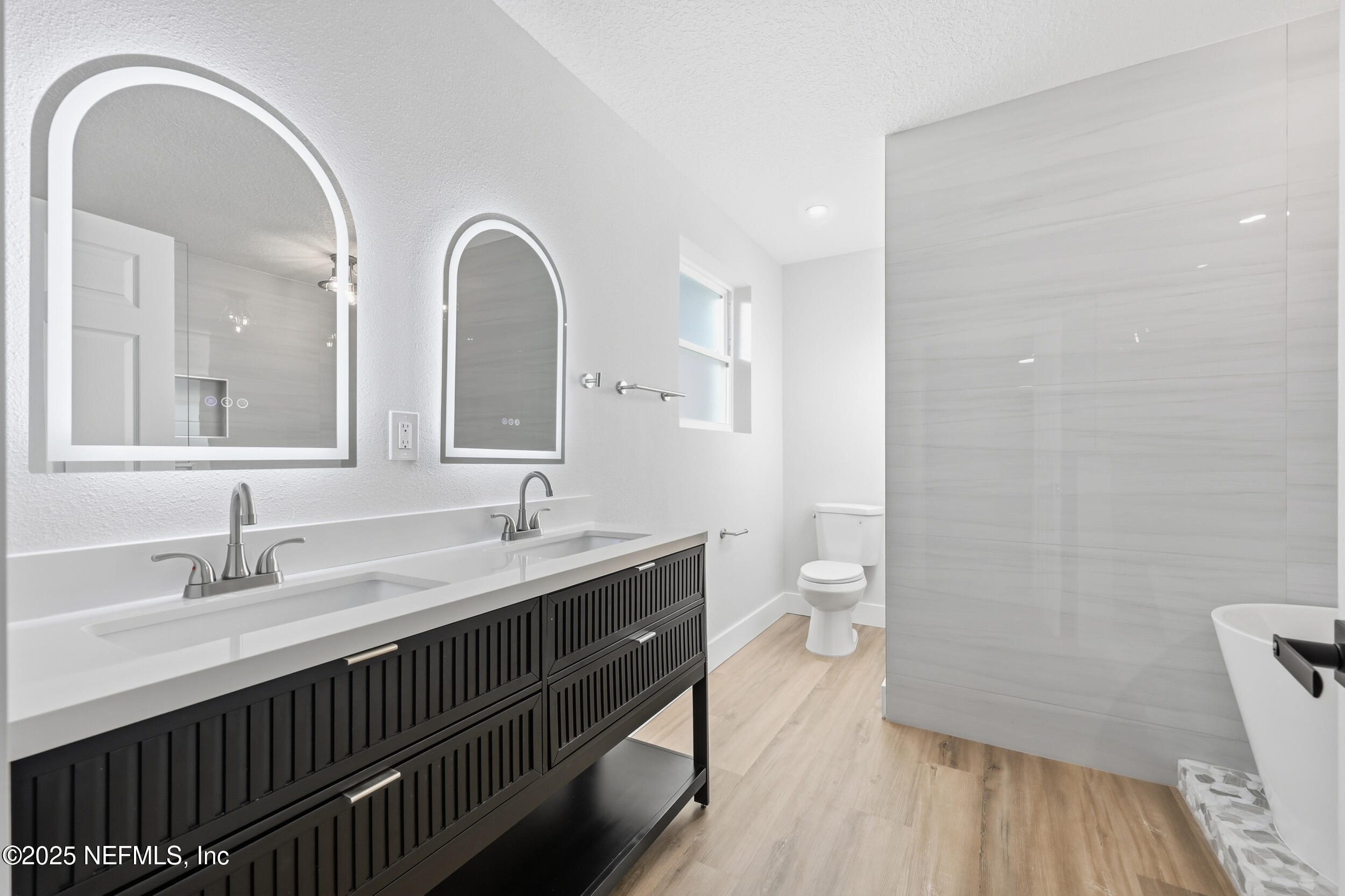 1440 Harbor Oaks Road Jacksonville, FL 32207 - Photo 29 of 63 a bathroom with a double vanity sink and a mirror