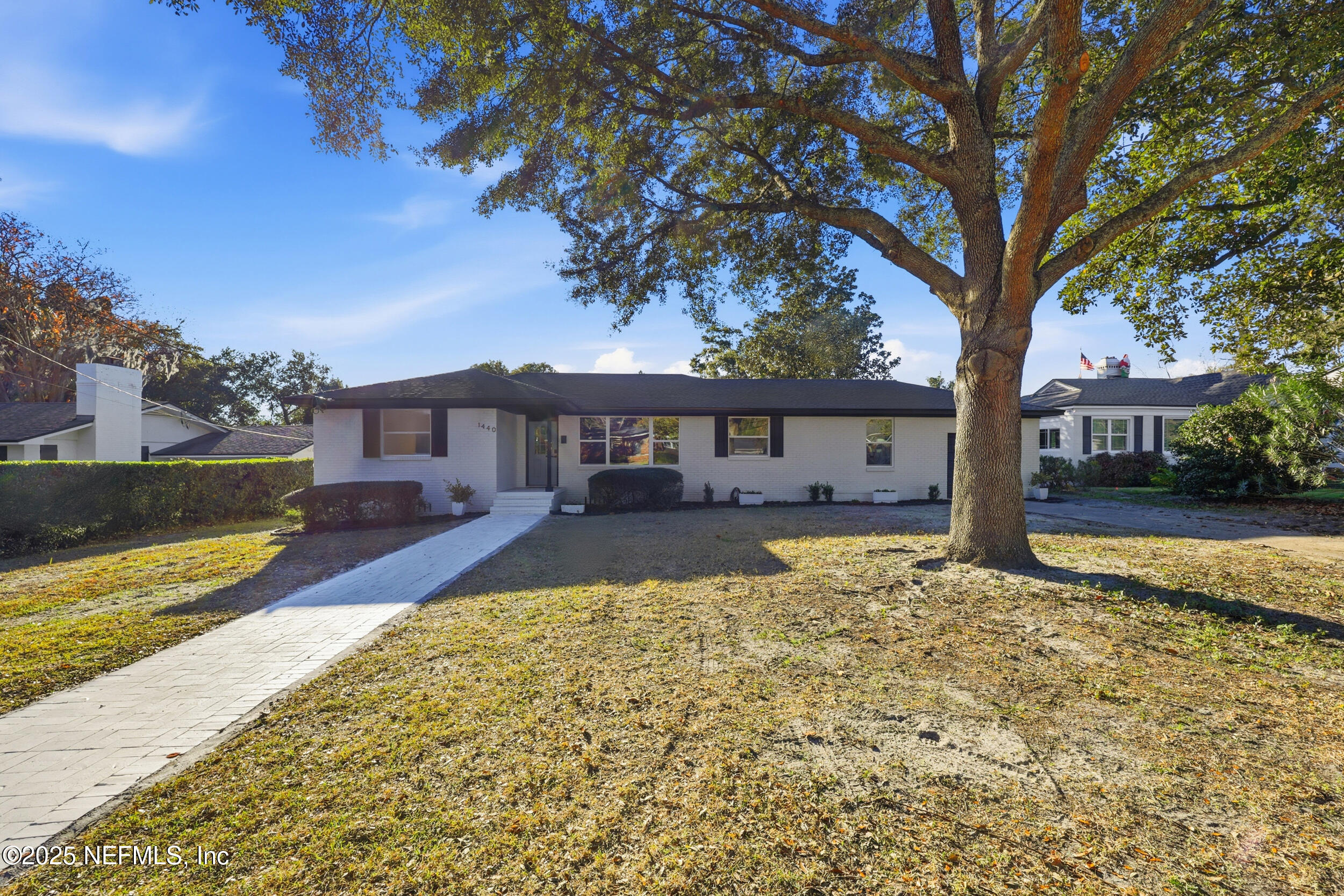 1440 Harbor Oaks Road Jacksonville, FL 32207 - Photo 49 of 63 a front view of a house with a yard