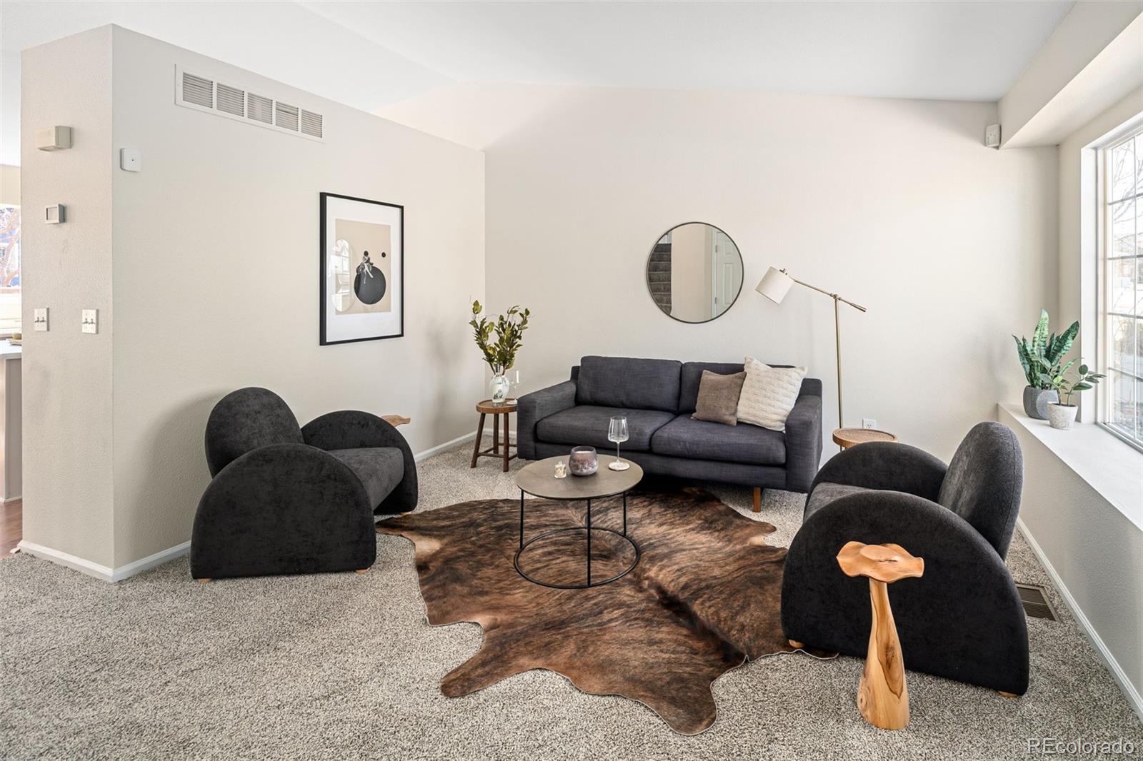 9741 Moss Rose Circle Highlands Ranch, CO 80129 - Photo 20 of 46 a living room with furniture rug and window