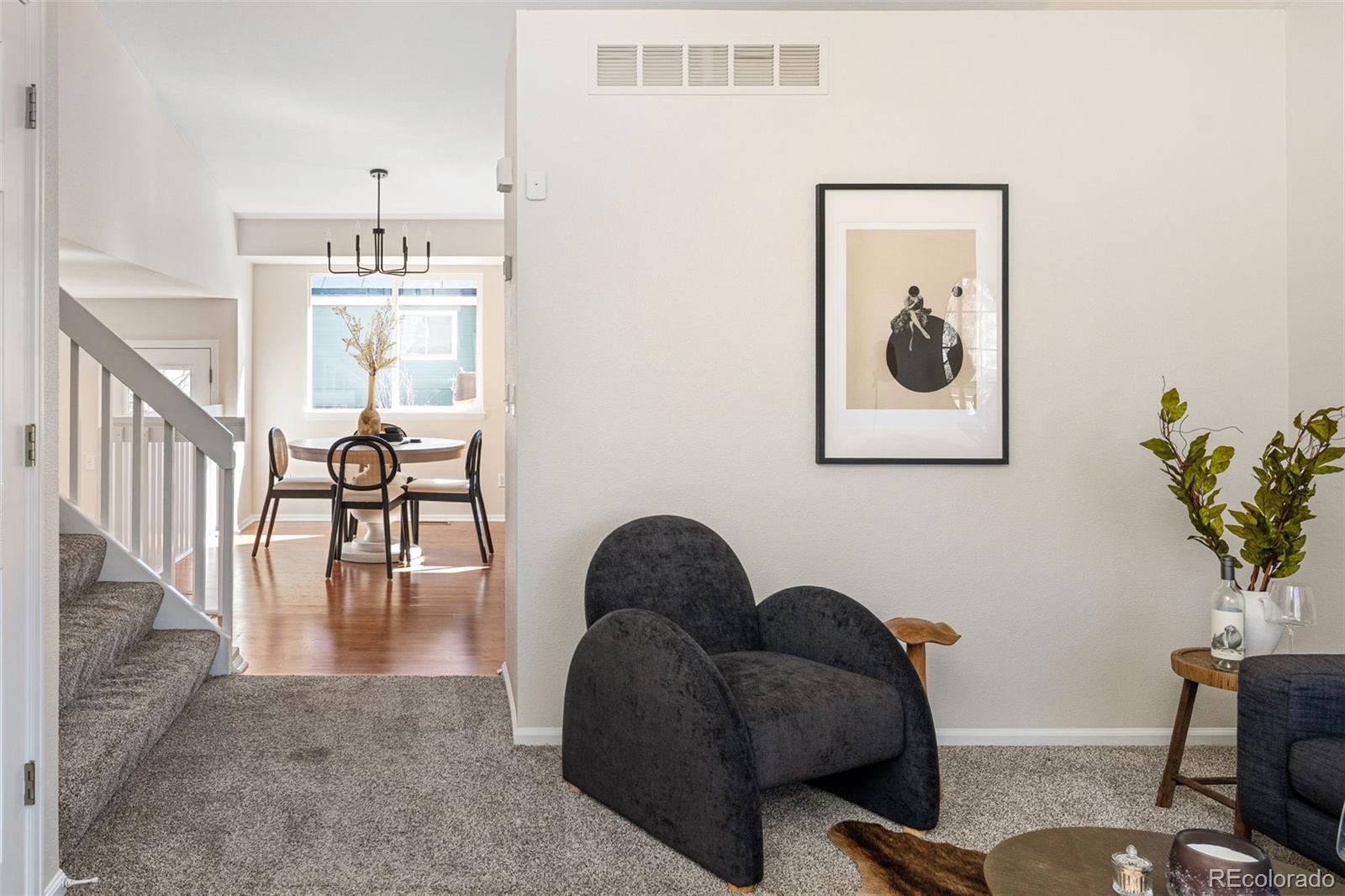 9741 Moss Rose Circle Highlands Ranch, CO 80129 - Photo 21 of 46 a living room with furniture and a potted plant