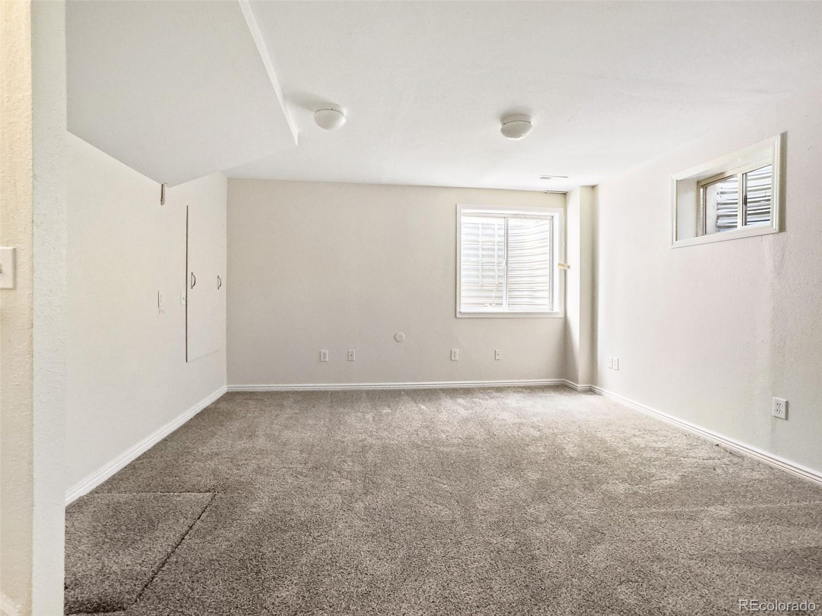9741 Moss Rose Circle Highlands Ranch, CO 80129 - Photo 30 of 46 an empty room with windows