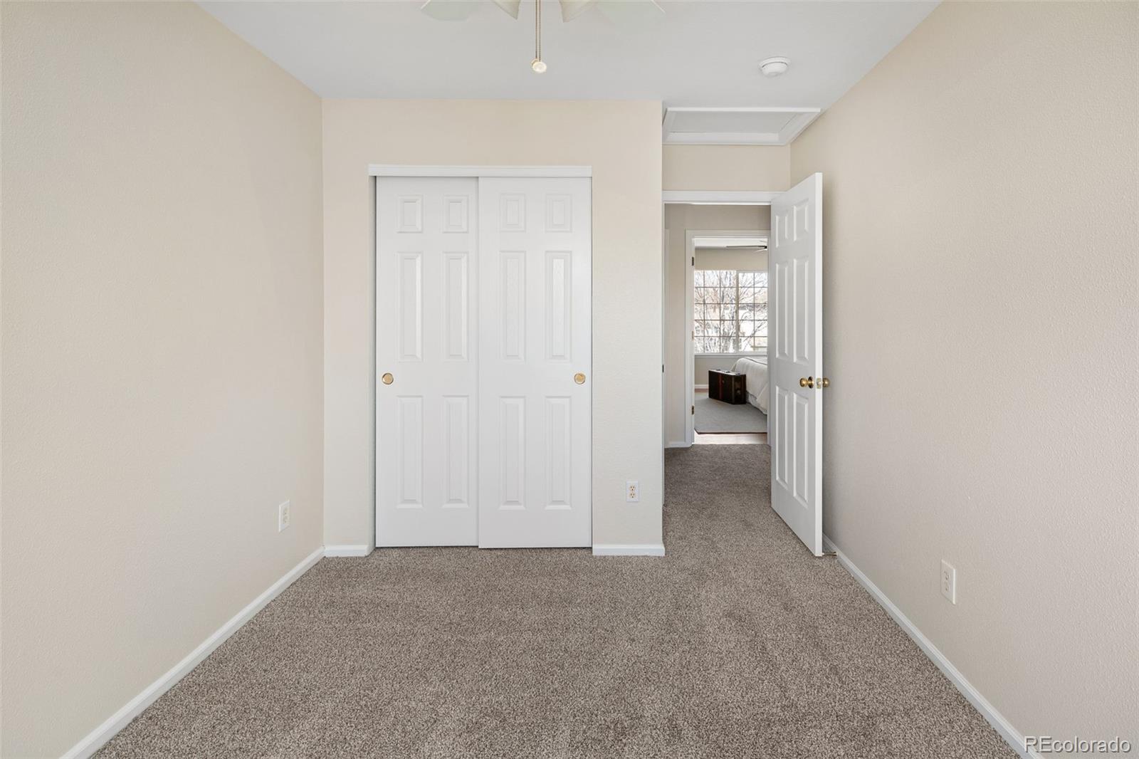 9741 Moss Rose Circle Highlands Ranch, CO 80129 - Photo 37 of 46 an empty room with windows