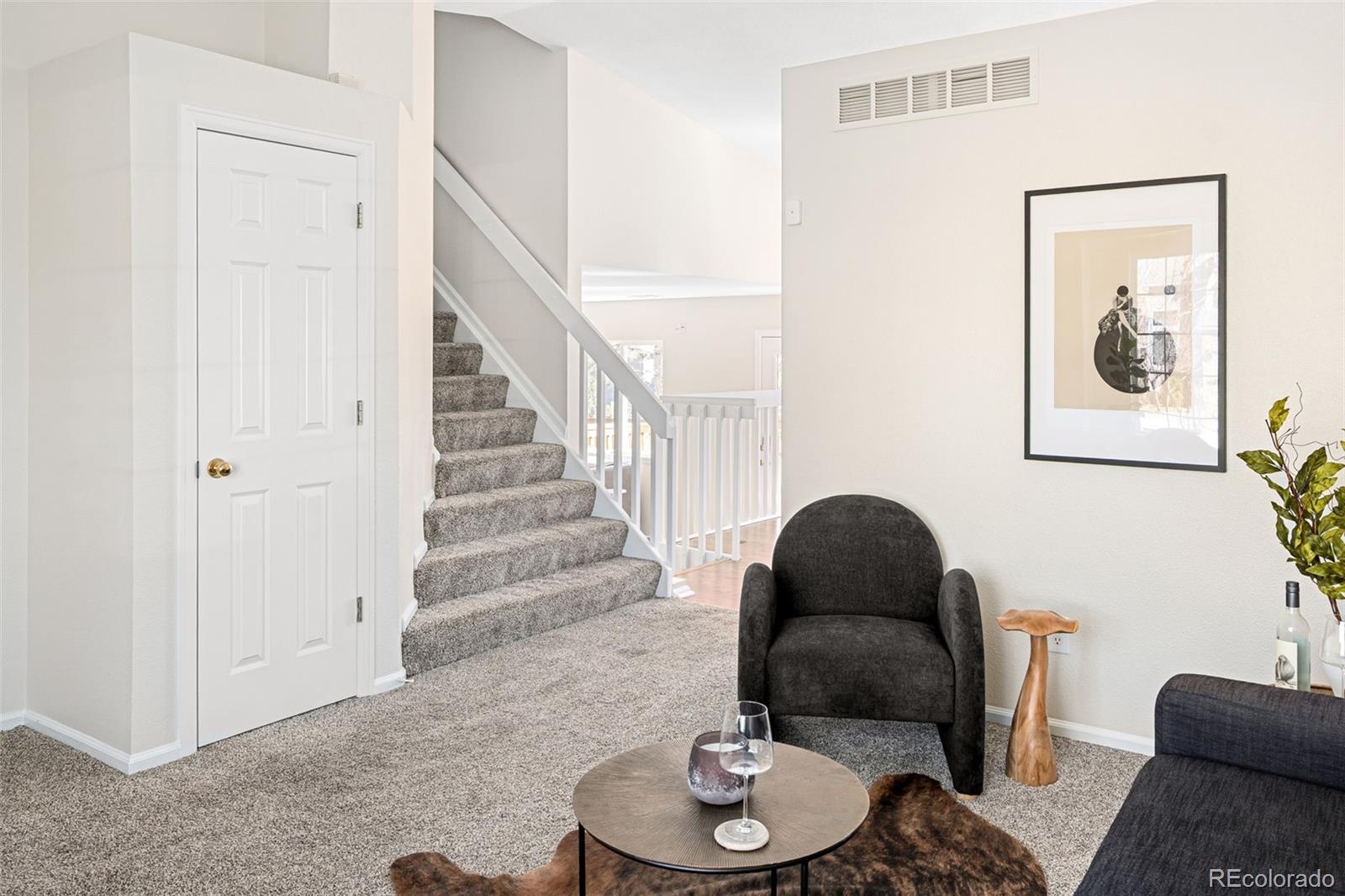 9741 Moss Rose Circle Highlands Ranch, CO 80129 - Photo 10 of 46 a living room with furniture and a chair