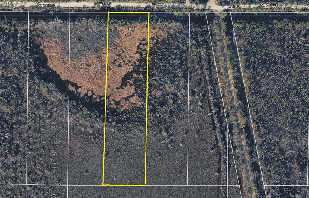 33301 Oil Well Road Punta Gorda, FL 33955 - Photo 2 of 2 a view of a pathway both side of a house